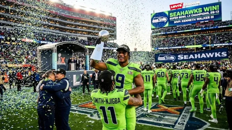 Seattle Seahawks celebrate NFL 2026 Super Bowl LX victory over New England Patriots 29-13 with Kenneth Walker III holding Lombardi Trophy
